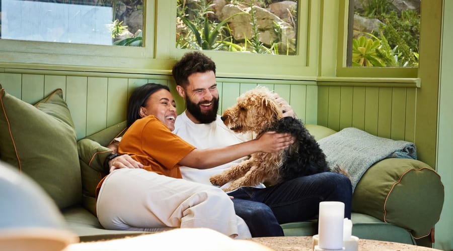 Pregnant woman bonding with her dog at home – preparing pup for new baby with Star Puppy Academy LLC Las Vegas
